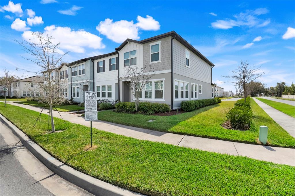 3270 Water Sprite Street Orlando, FL 32808 - Photo 5 of 34 a front view of a house with garden