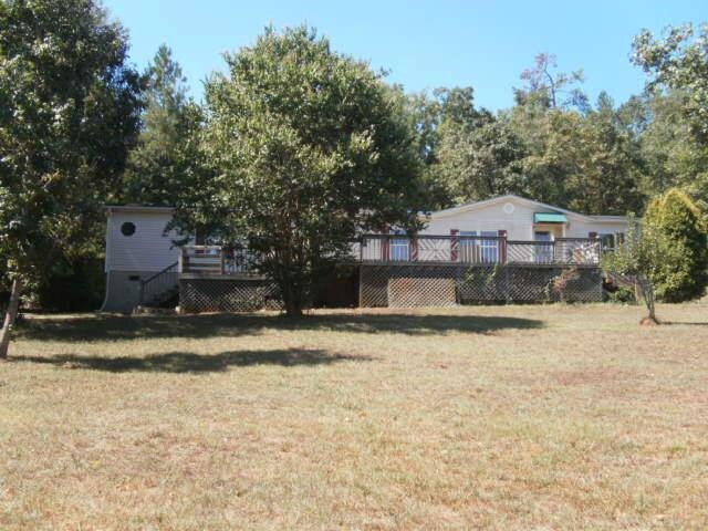 3031 Mallard Ridge Road Madison, GA 30650 - Photo 1 of 1 a front view of a house with a yard and garage