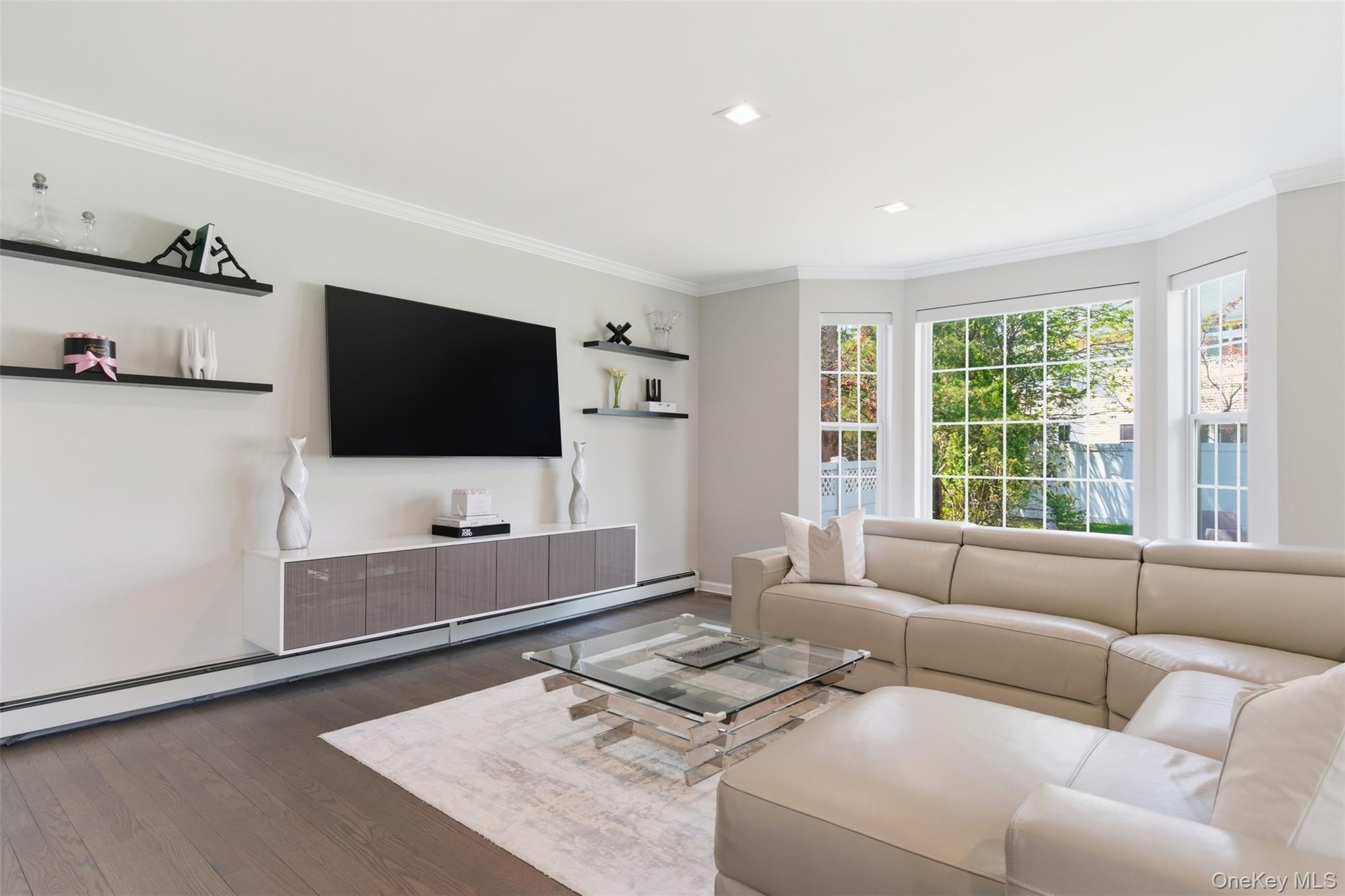 159 Rivendell Court Melville, NY 11747 - Photo 15 of 38 a living room with furniture and a flat screen tv