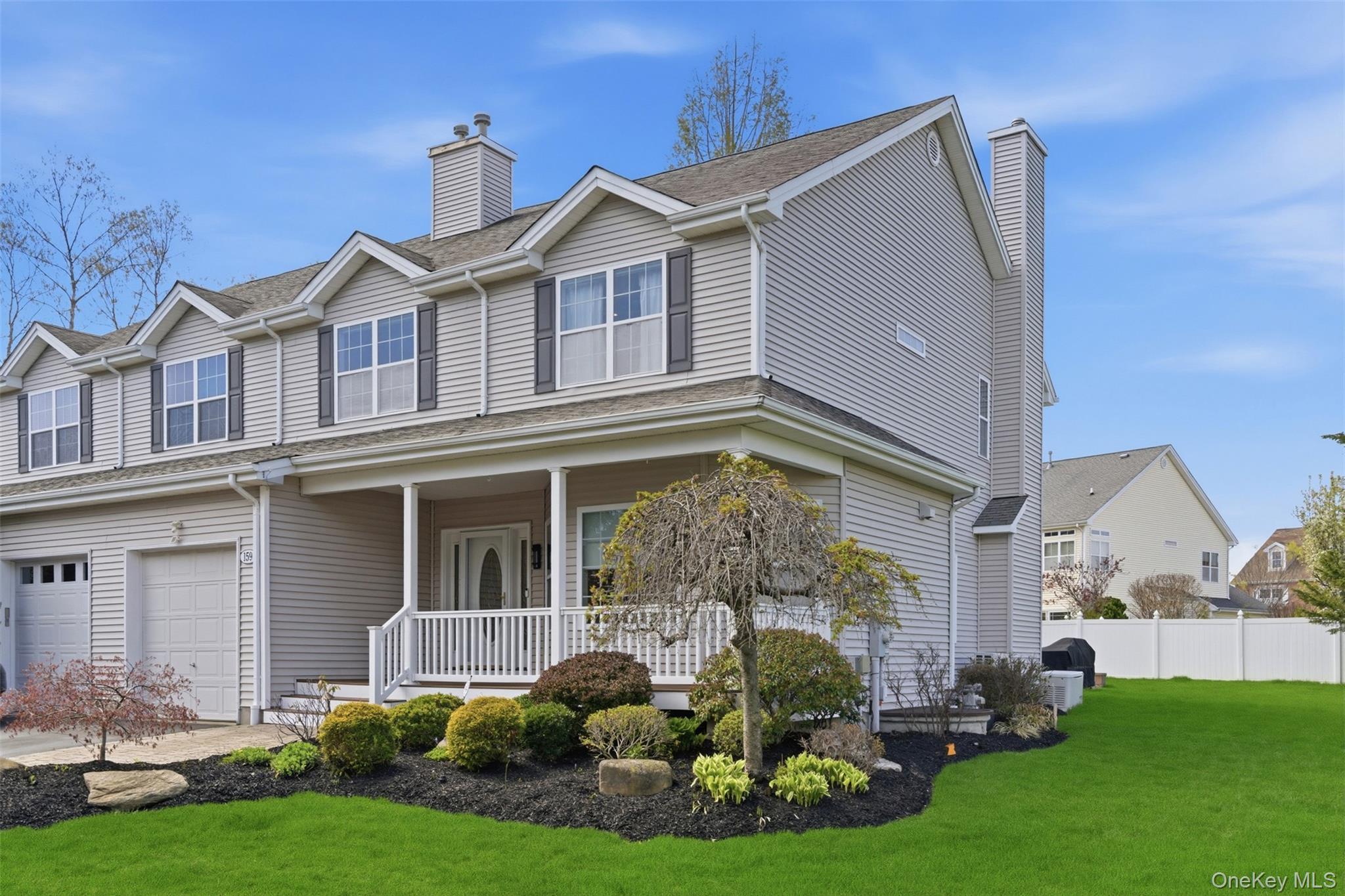 159 Rivendell Court Melville, NY 11747 - Photo 2 of 38 a front view of a house with a yard