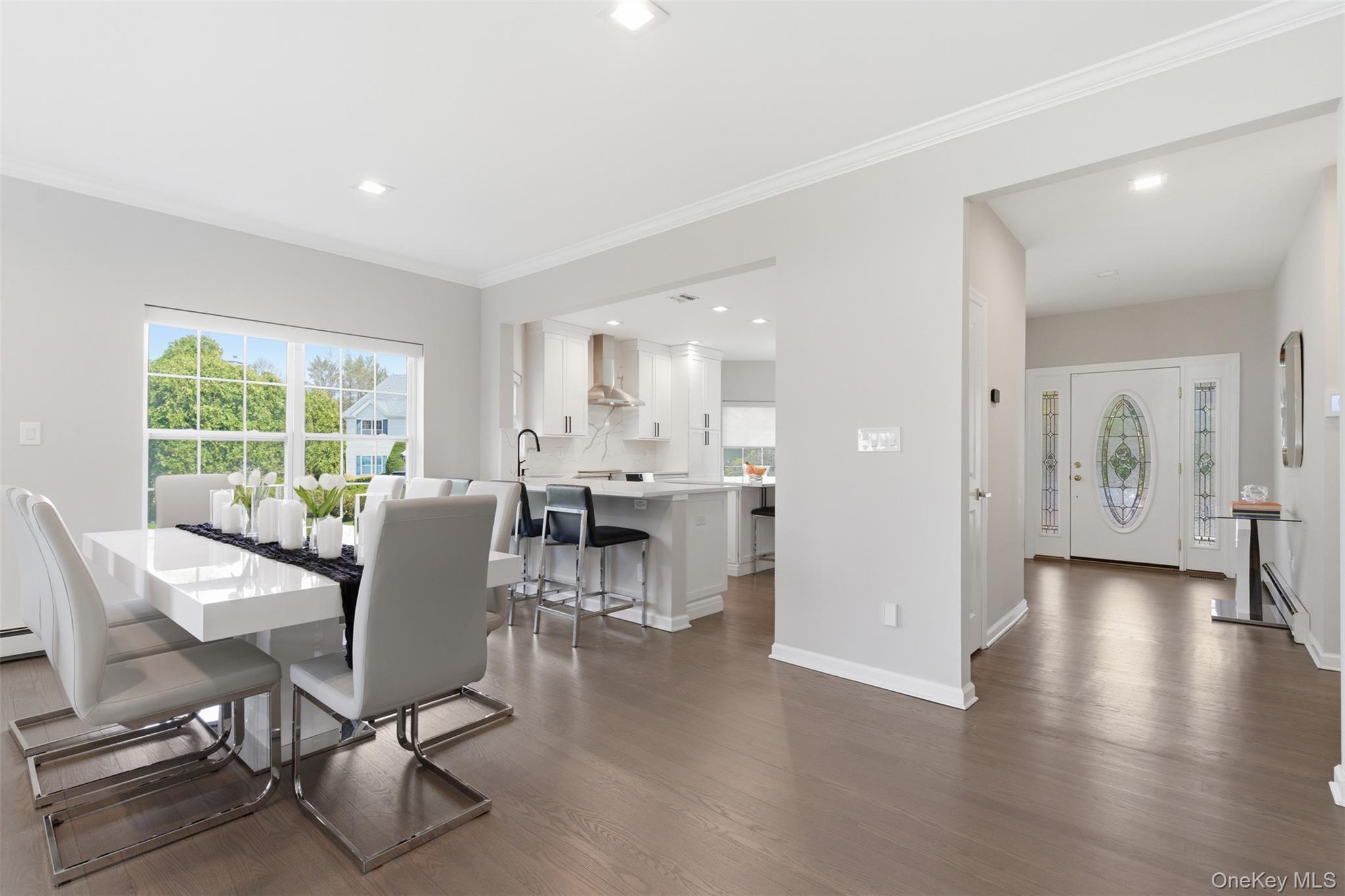 159 Rivendell Court Melville, NY 11747 - Photo 22 of 38 a view of a dining room with furniture window and wooden floor
