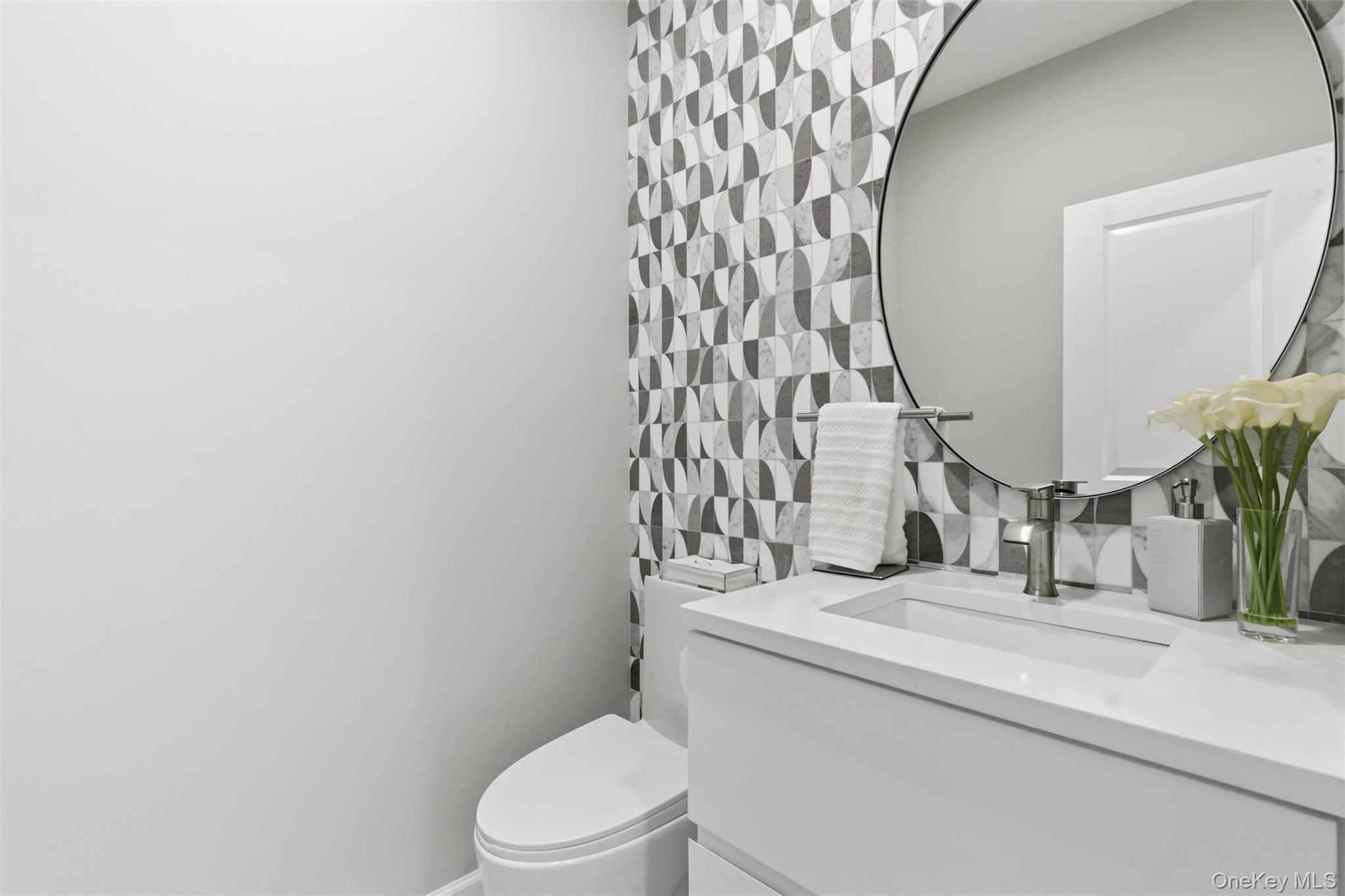 159 Rivendell Court Melville, NY 11747 - Photo 23 of 38 a bathroom with a toilet and a sink