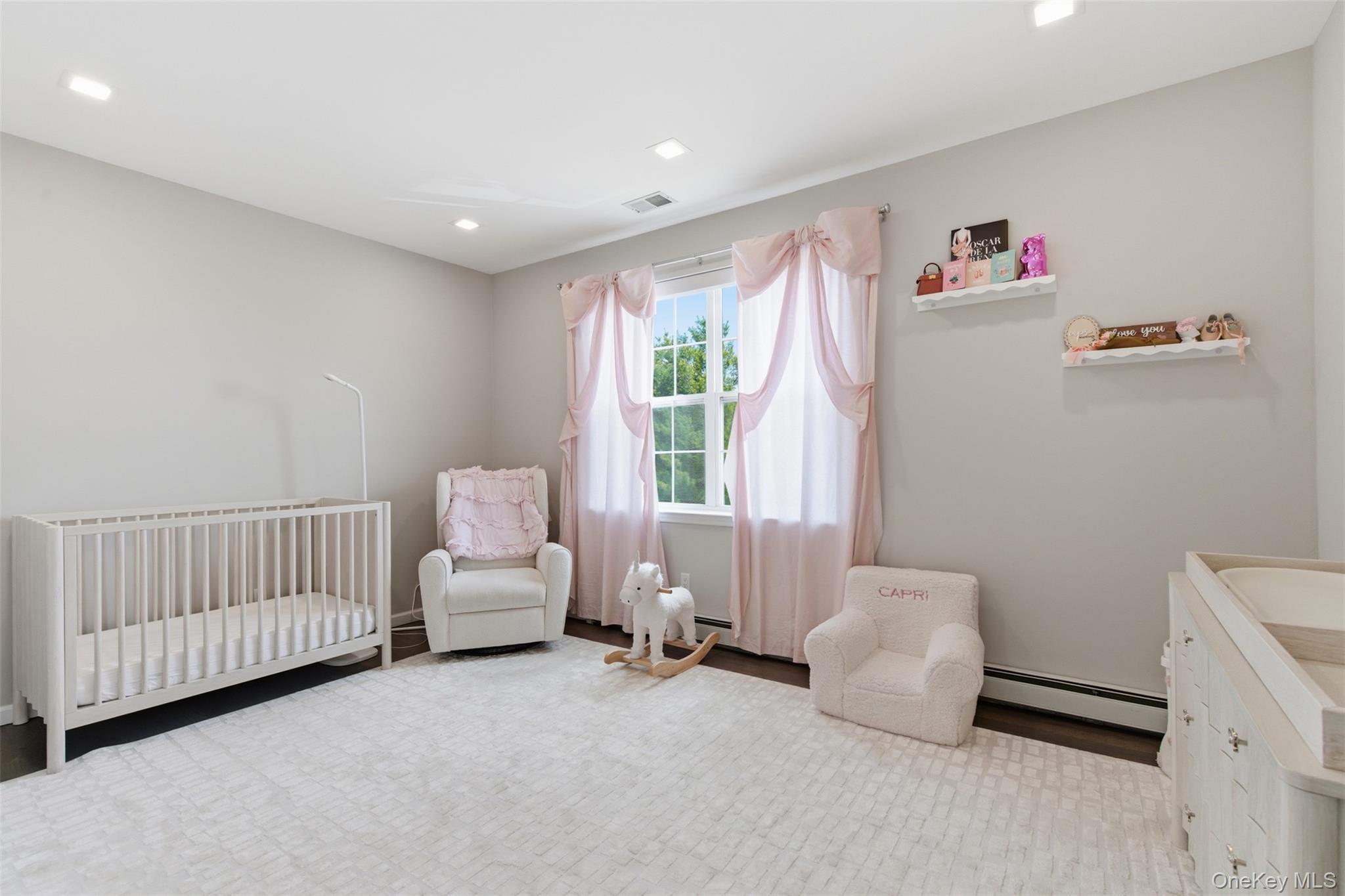 159 Rivendell Court Melville, NY 11747 - Photo 28 of 38 a bedroom with furniture and a window