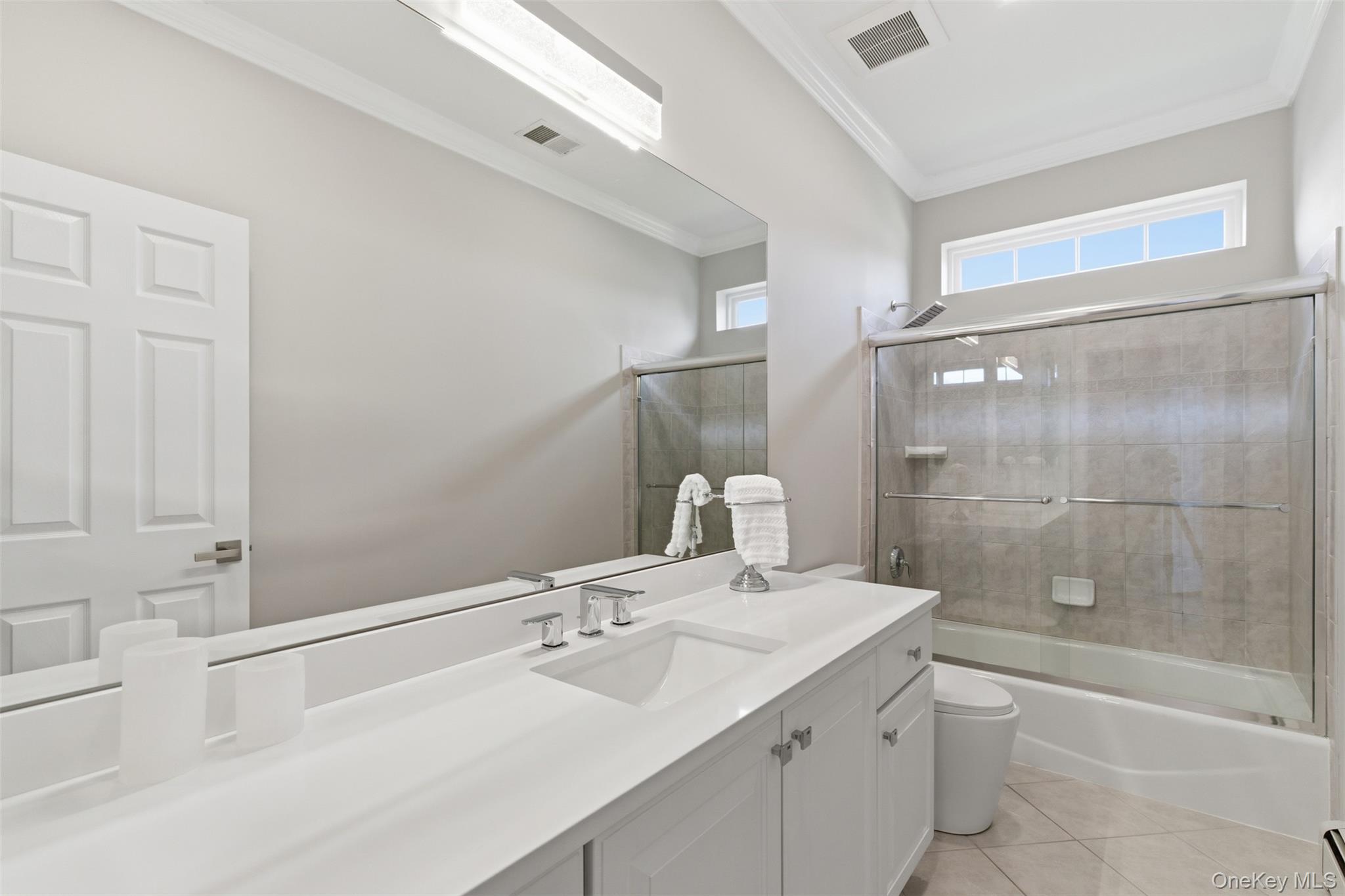 159 Rivendell Court Melville, NY 11747 - Photo 29 of 38 a bathroom with a sink and a mirror