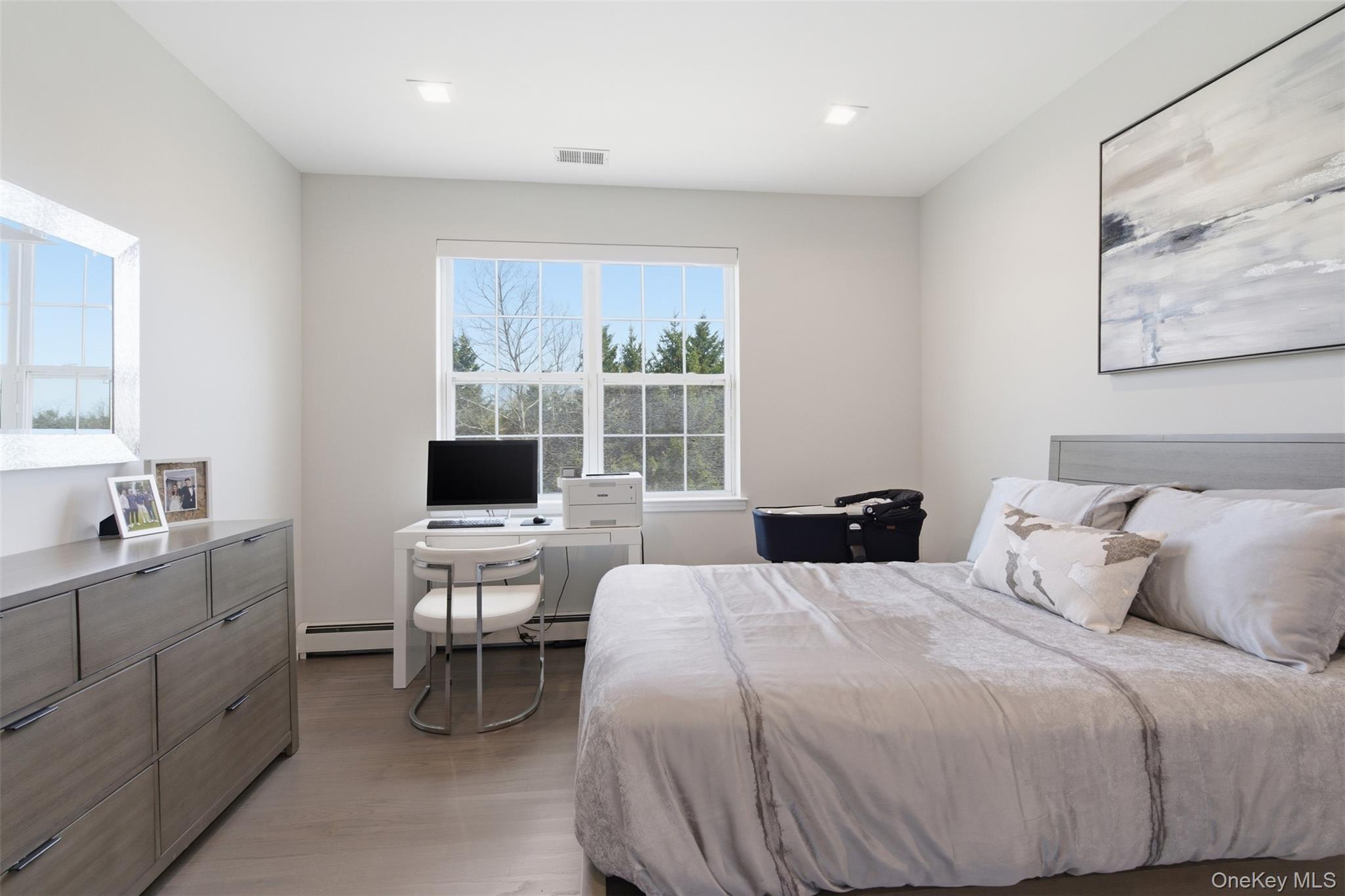 159 Rivendell Court Melville, NY 11747 - Photo 30 of 38 a bedroom with a bed and a flat screen tv