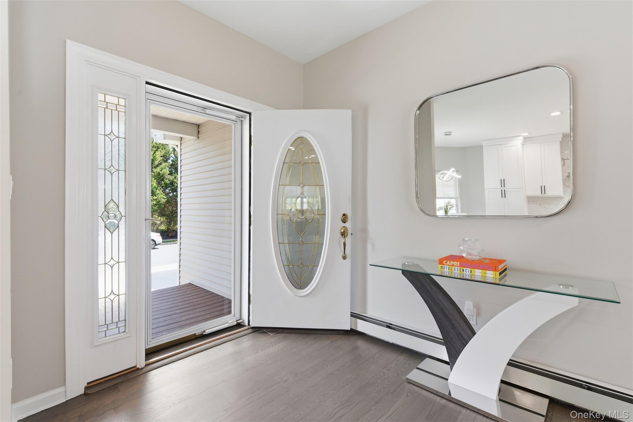 159 Rivendell Court Melville, NY 11747 - Photo 3 of 38 a workspace with wooden floor and a mirror