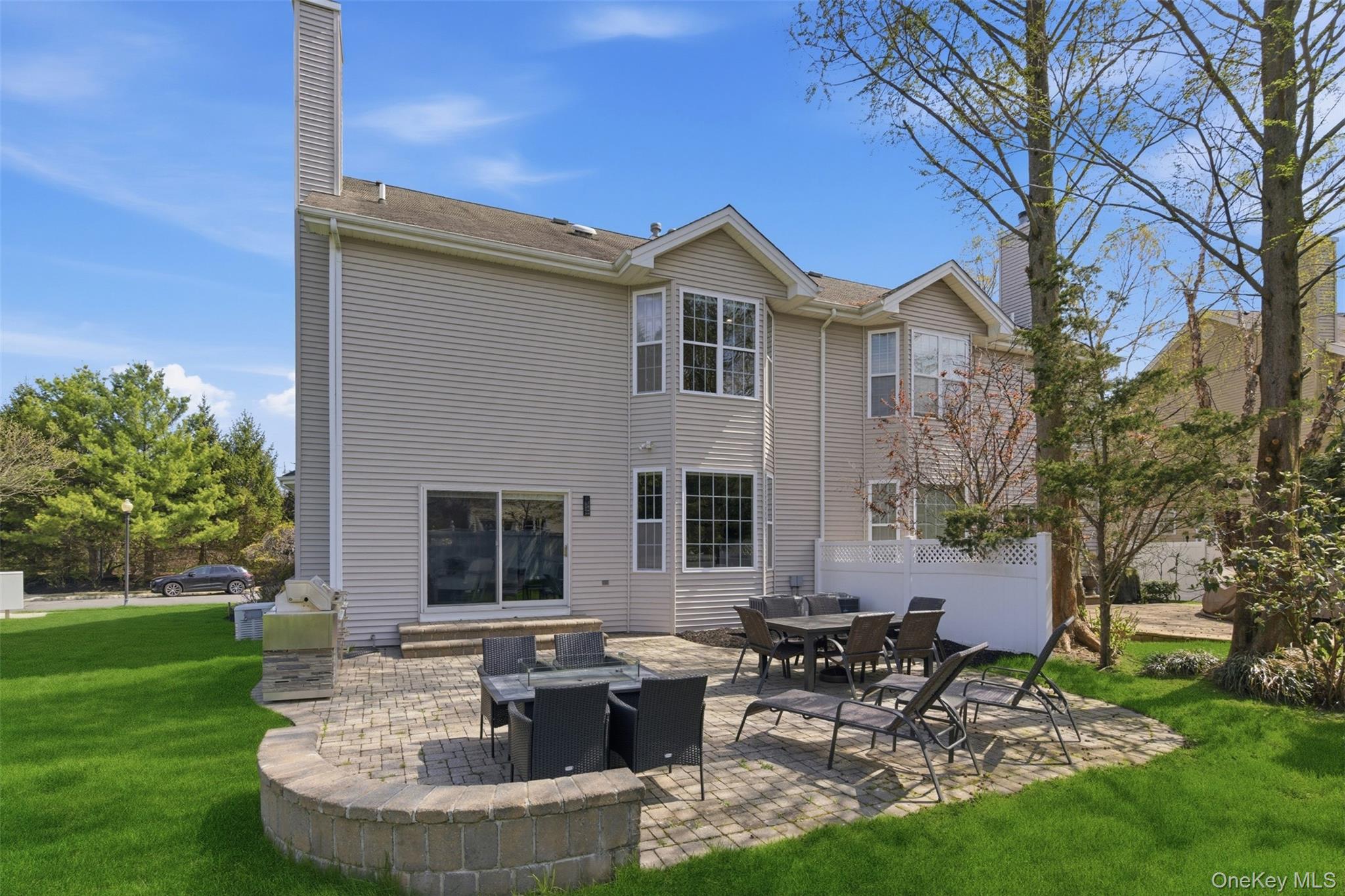 159 Rivendell Court Melville, NY 11747 - Photo 31 of 38 a view of a house with patio