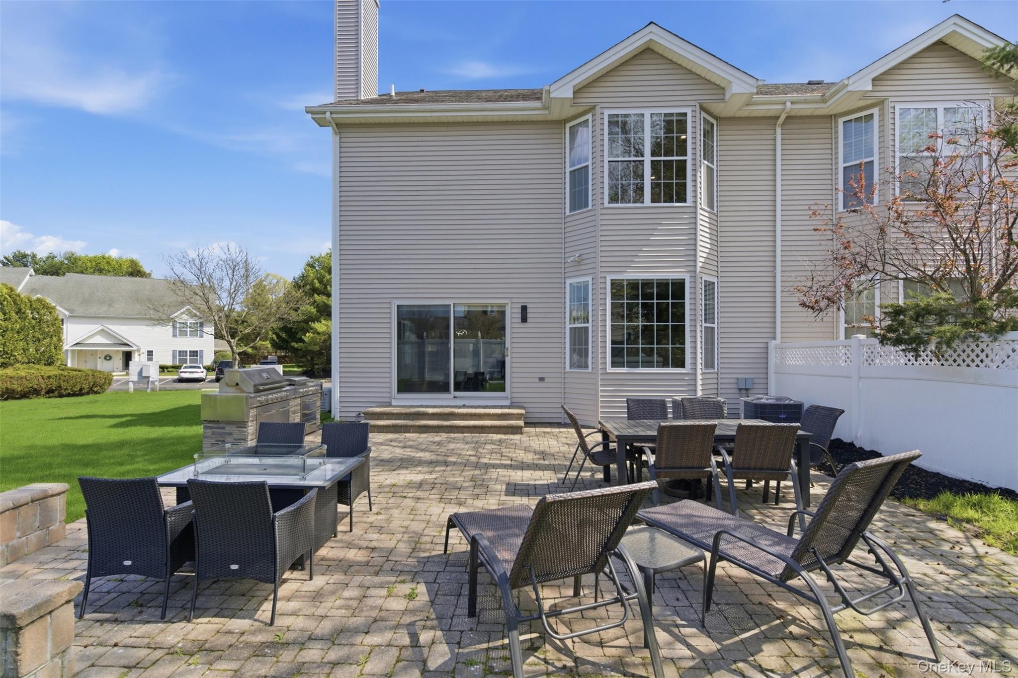 159 Rivendell Court Melville, NY 11747 - Photo 32 of 38 a view of a house with backyard sitting area and garden