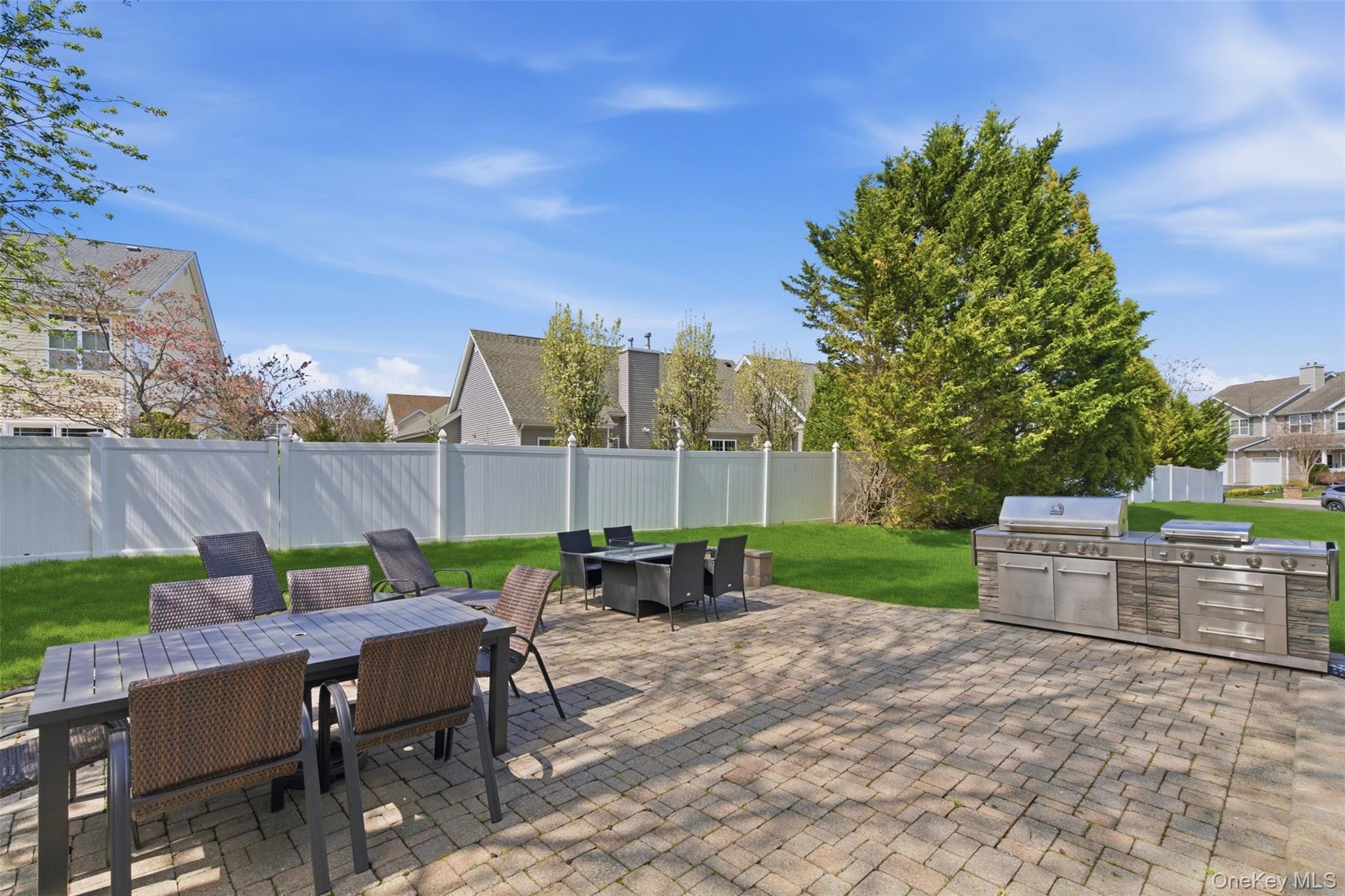 159 Rivendell Court Melville, NY 11747 - Photo 34 of 38 a view of a chairs and table in patio