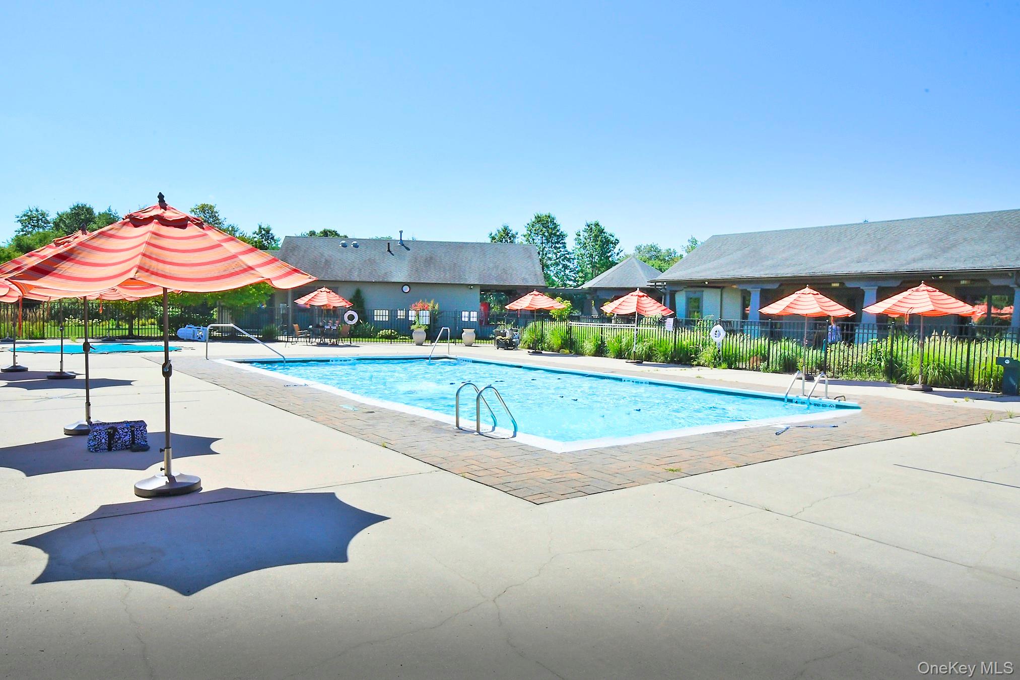 159 Rivendell Court Melville, NY 11747 - Photo 38 of 38 a view of a house with a swimming pool and a yard