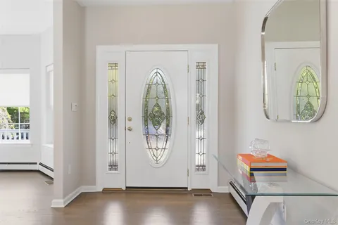 a kitchen with a table chairs stove and cabinets