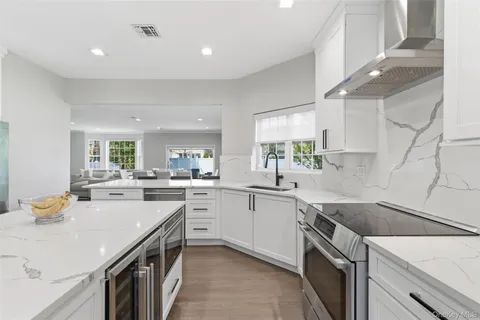 a kitchen that has a lot of cabinets in it
