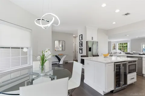 a kitchen with a sink stainless steel appliances and cabinets
