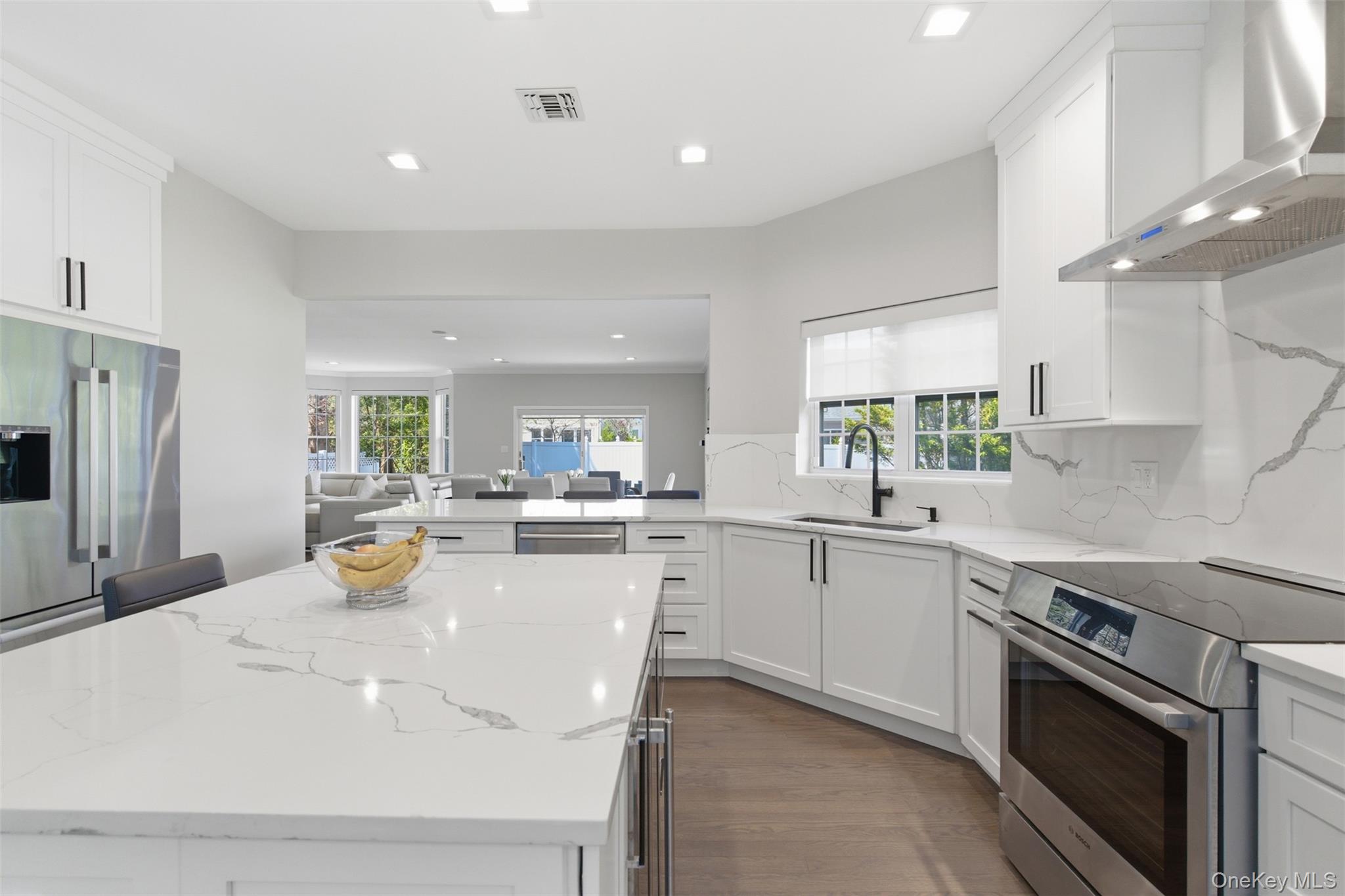 159 Rivendell Court Melville, NY 11747 - Photo 9 of 38 a kitchen with a sink stainless steel appliances and cabinets