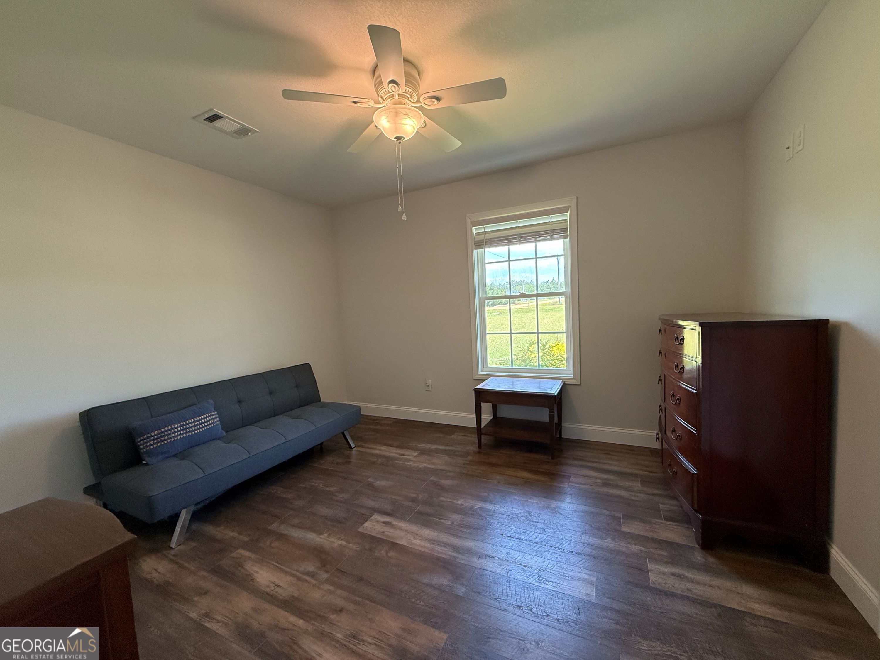 365 Quail Lane Alston, GA 30473 - Photo 7 of 9 a living room with furniture and a window