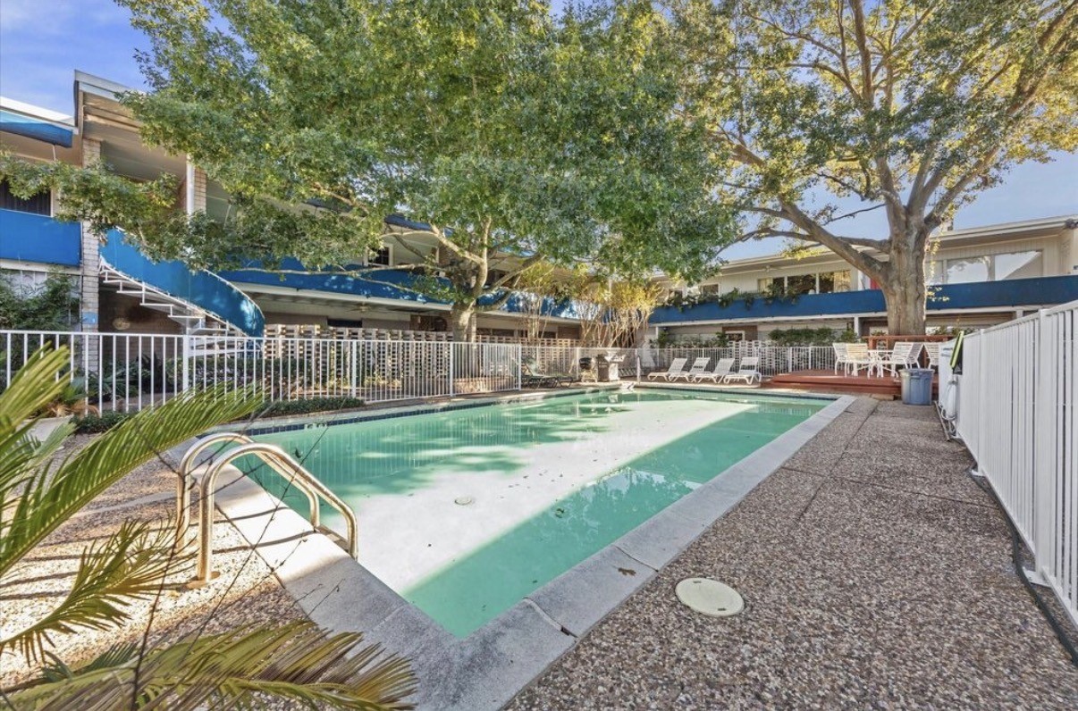 3271 Sul Ross Street, Unit 11 Houston, TX 77098 - Photo 4 of 12 a view of a house with a yard