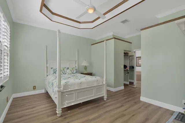 a bathroom with a granite countertop sink mirror and bathtub