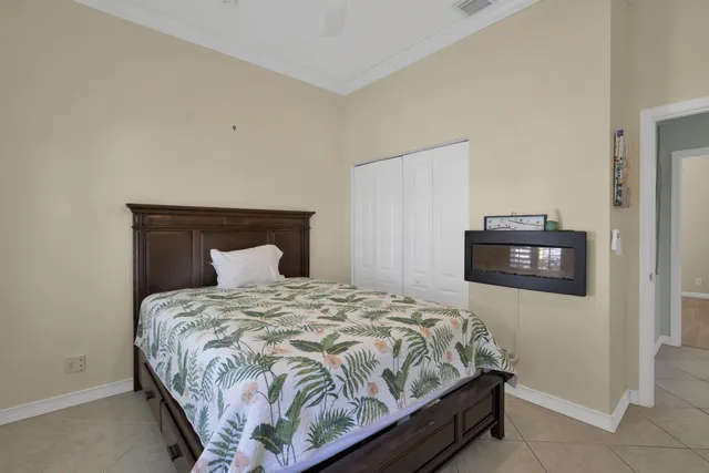 a living room with patio furniture and a floor to ceiling window
