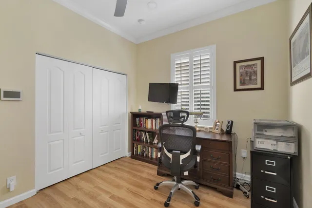 a view of a house with a backyard and a tree