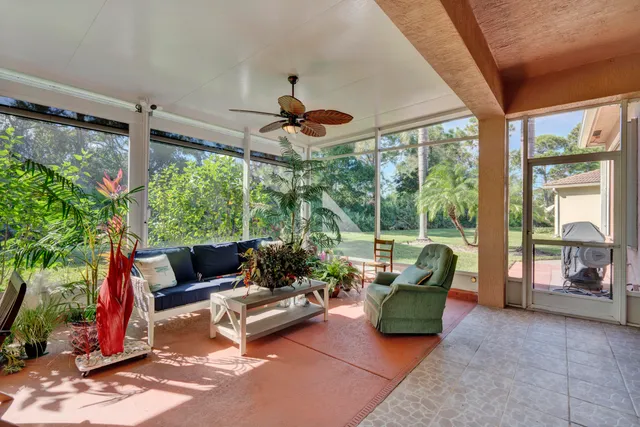 an aerial view of a house with swimming pool and garden