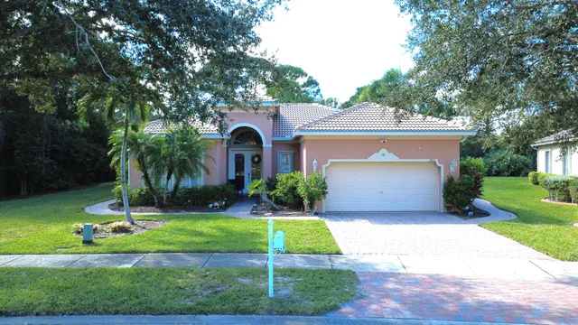 a view of a dining room with furniture and window