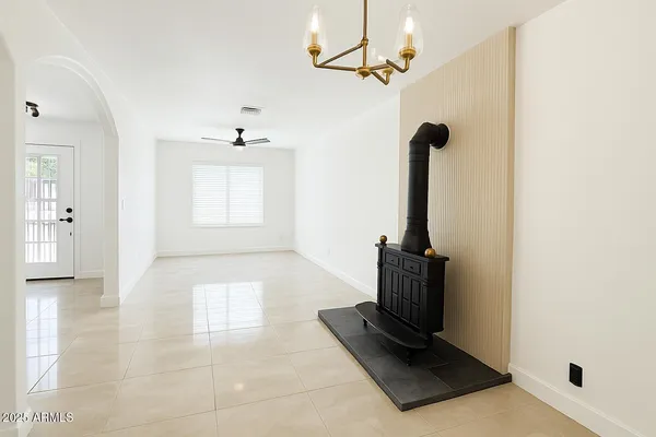 a bathroom with a granite countertop toilet sink and mirror