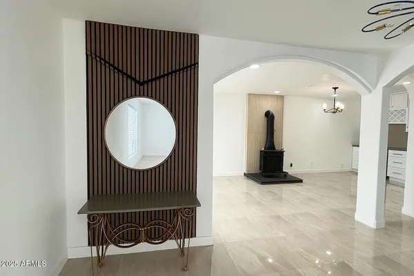 a bathroom with a granite countertop sink a toilet and shower
