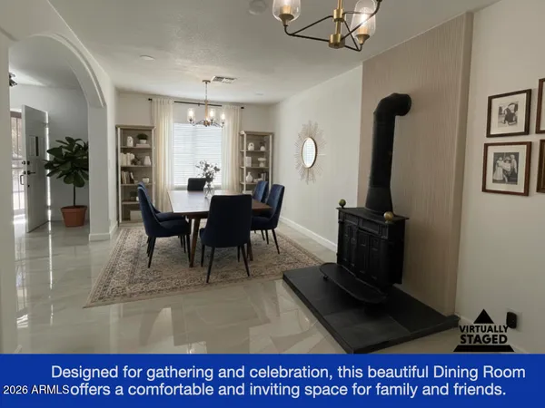 a living room with furniture rug and a window