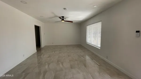 a large kitchen with stainless steel appliances granite countertop a sink and cabinets