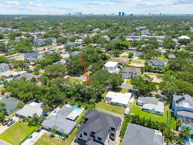 an aerial view of a city with lots of residential buildings