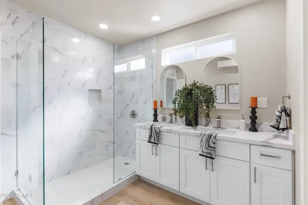 a bathroom with a sink and mirror