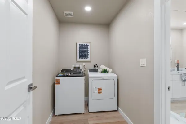 a view of a storage & utility room with washer and dryer