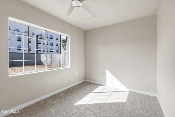 a view of an empty room with a window
