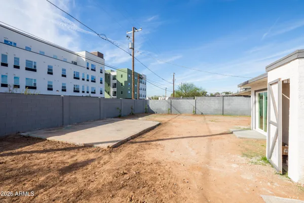 a view of a room with a wooden fence