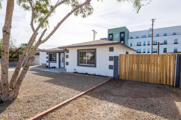 a view of a backyard with a patio