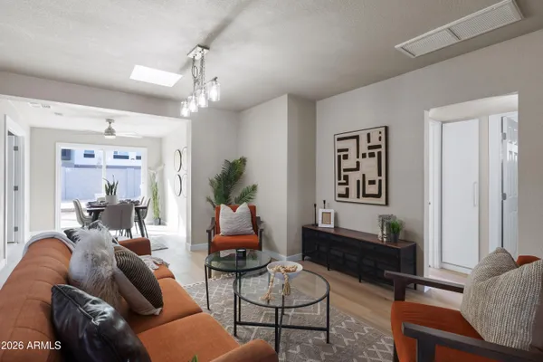 a living room with furniture and a window