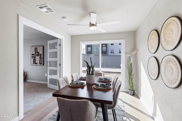 a view of a dining room with furniture window and wooden floor