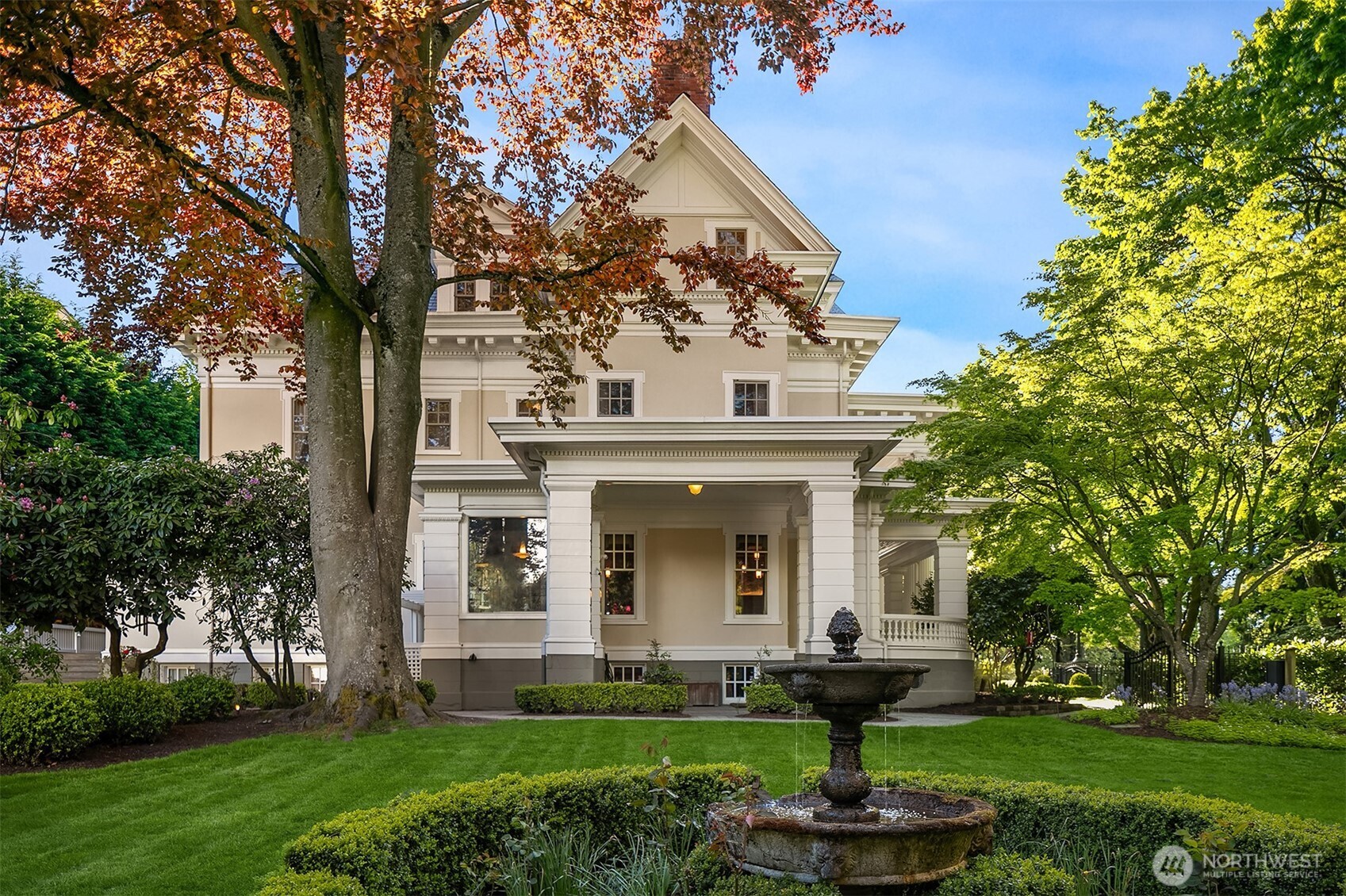 1409 East Prospect Street Seattle, WA 98112 - Photo 2 of 34 a front view of a house with garden and trees