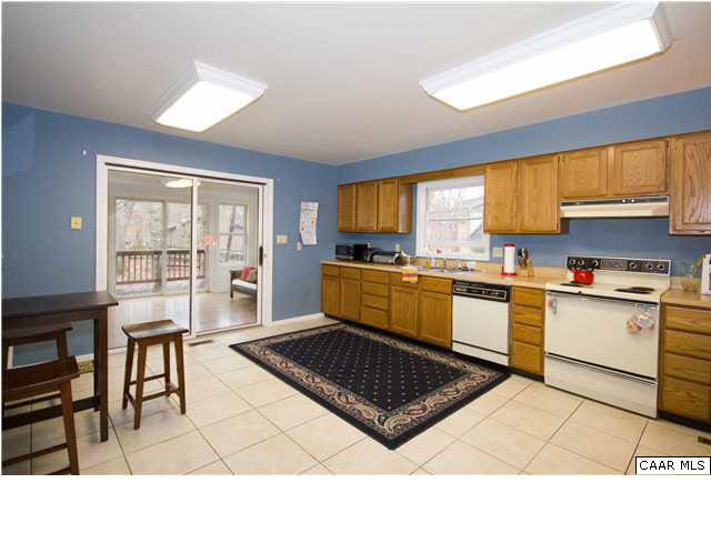 60 Laguna Road Palmyra, VA 22963 - Photo 1 of 25 a kitchen with a stove a sink a counter top space and cabinets