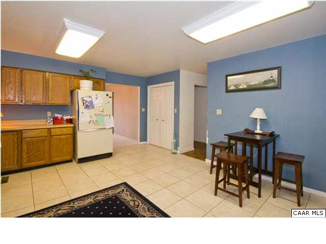 60 Laguna Road Palmyra, VA 22963 - Photo 4 of 25 a open kitchen with a table and chairs in it