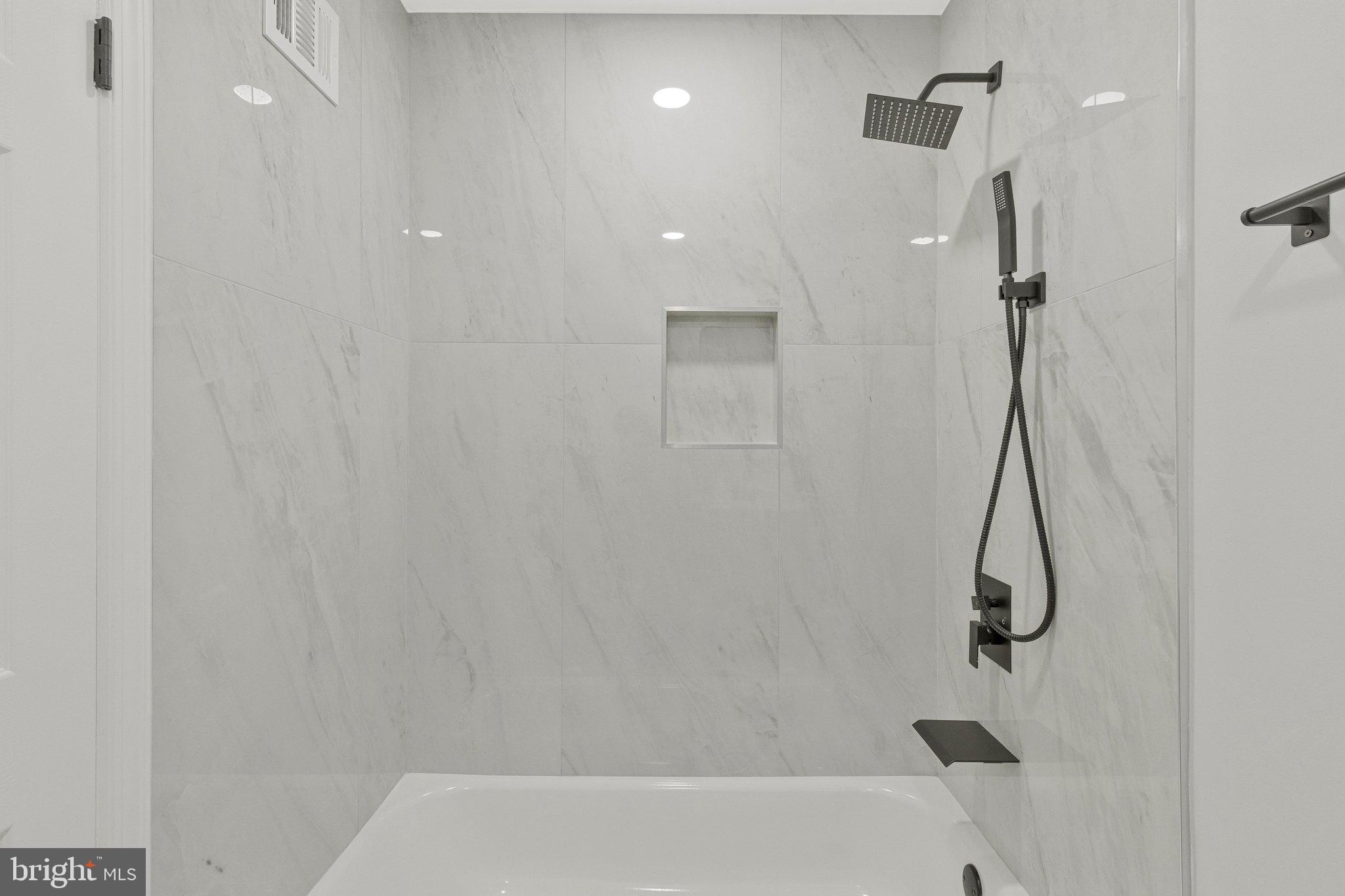 7269 Evanston Road Springfield, VA 22150 - Photo 20 of 41 a bathroom with a shower