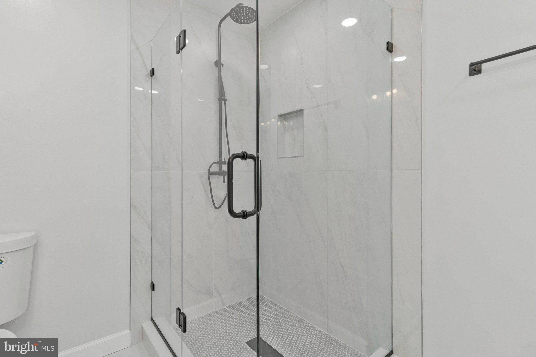 7269 Evanston Road Springfield, VA 22150 - Photo 26 of 41 a bathroom with a shower