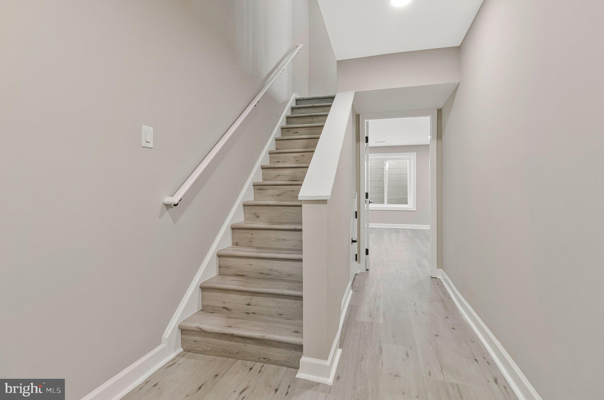 7269 Evanston Road Springfield, VA 22150 - Photo 28 of 41 a view of a hallway with staircase
