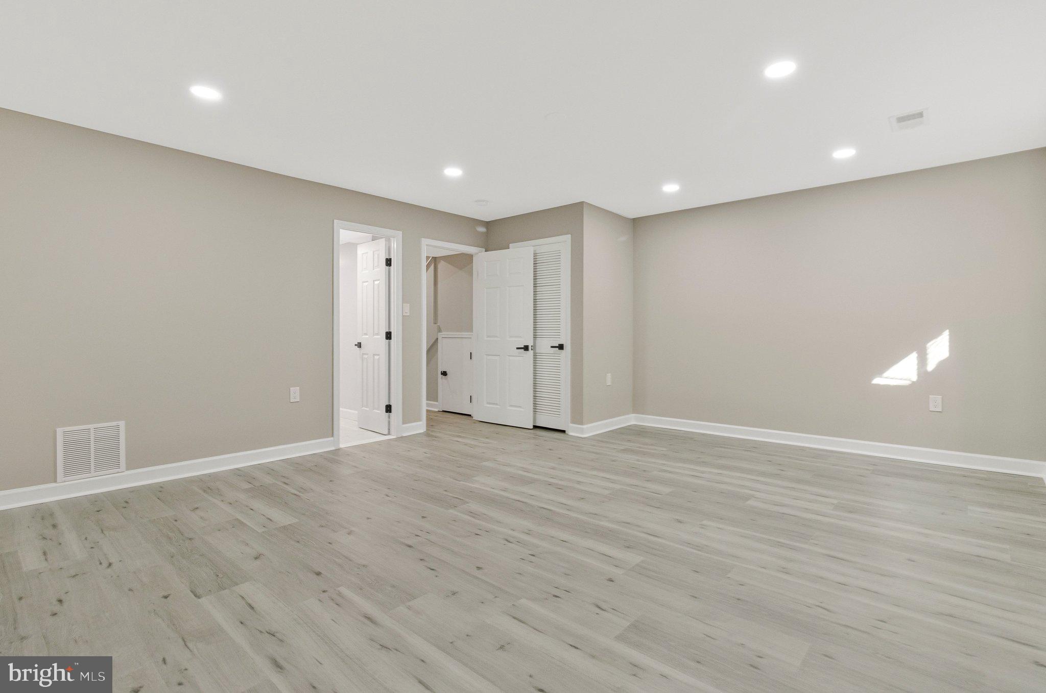 7269 Evanston Road Springfield, VA 22150 - Photo 33 of 41 a view of an empty room with wooden floor
