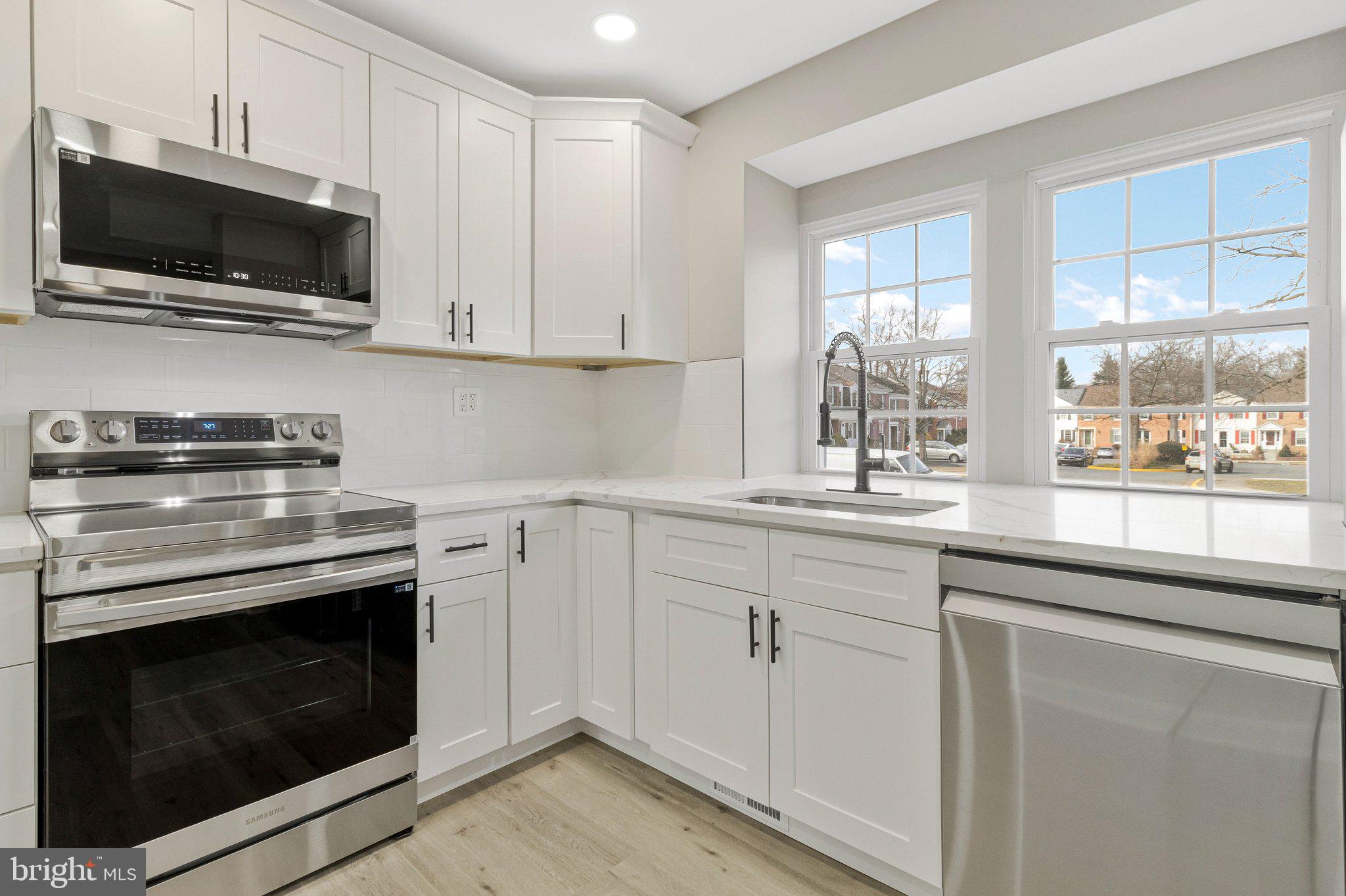 7269 Evanston Road Springfield, VA 22150 - Photo 5 of 41 a kitchen with cabinets stainless steel appliances and a window