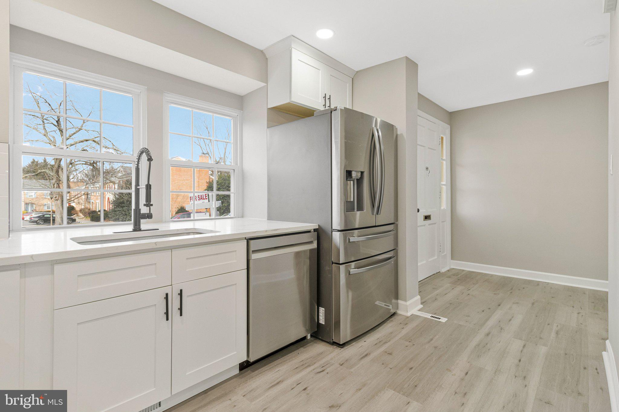 7269 Evanston Road Springfield, VA 22150 - Photo 6 of 41 a kitchen with stainless steel appliances a refrigerator and microwave