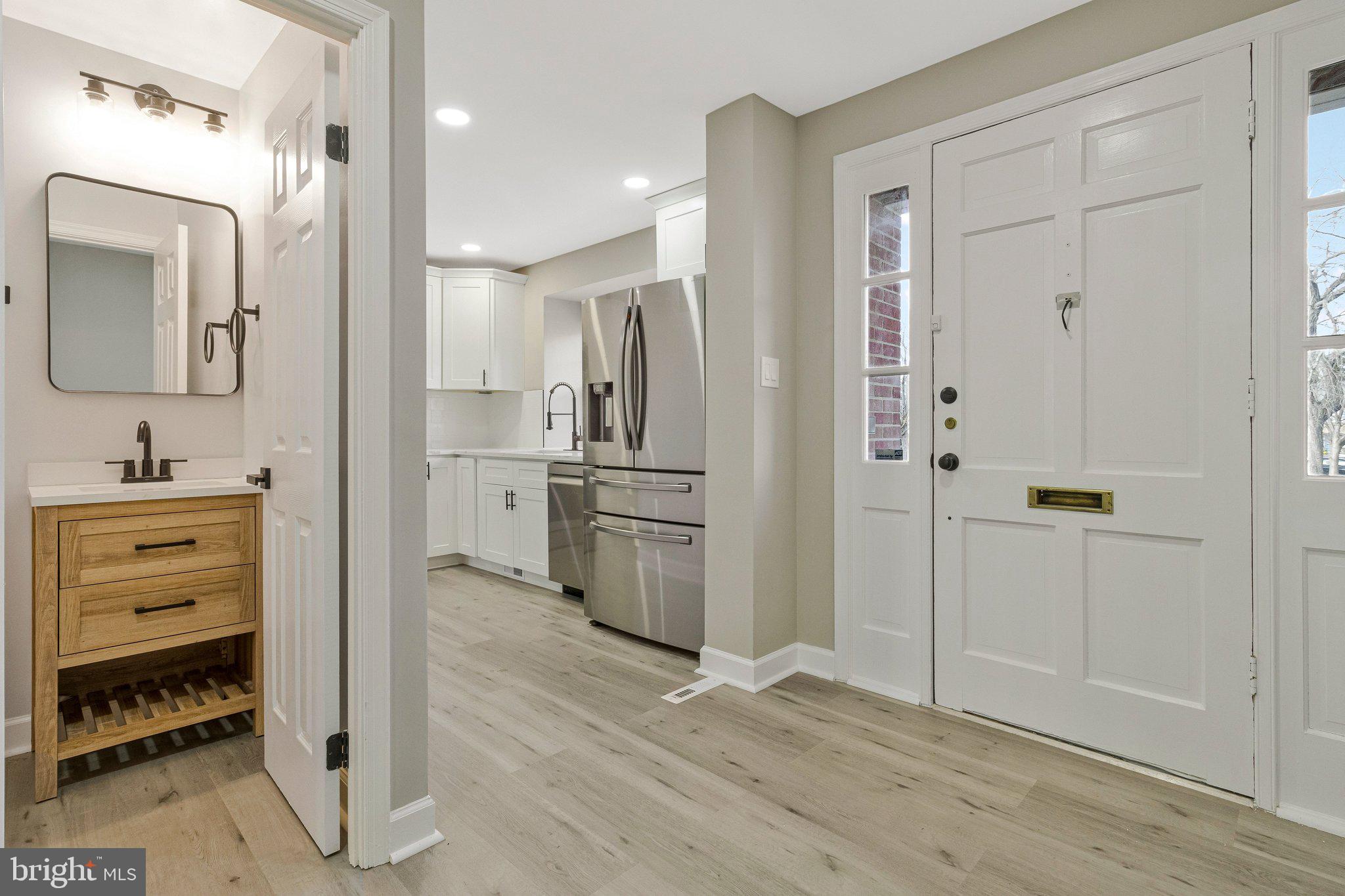 7269 Evanston Road Springfield, VA 22150 - Photo 9 of 41 a view of a bathroom with a sink and a mirror