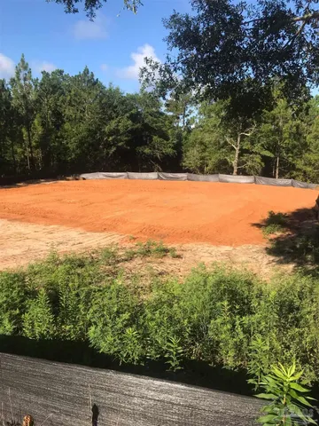 a view of a yard with an outdoor space