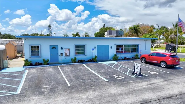 a front view of a house with a yard and a garage