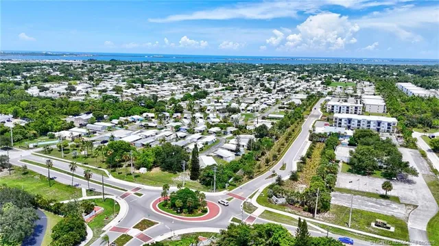 a view of a garden with lawn chairs
